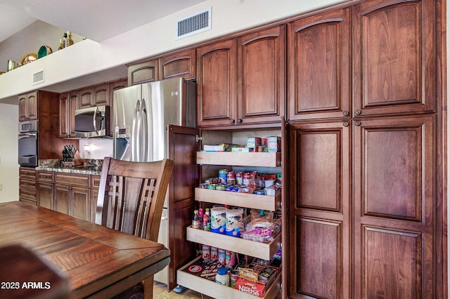 kitchen with stainless steel appliances and visible vents