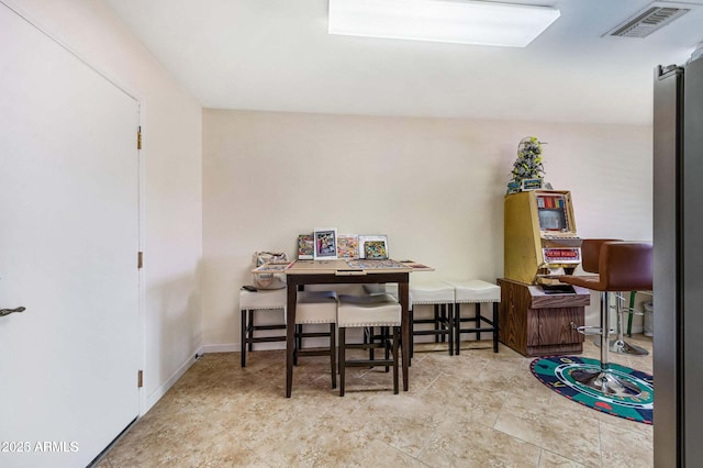 dining area featuring visible vents and baseboards