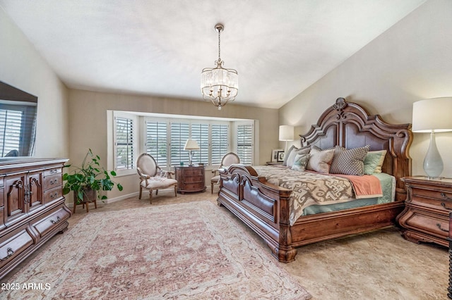 bedroom with baseboards, multiple windows, an inviting chandelier, and vaulted ceiling