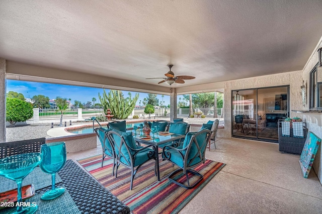 view of patio / terrace featuring a fenced in pool, ceiling fan, and fence