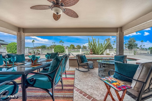 view of patio / terrace featuring outdoor dining area, a ceiling fan, and fence