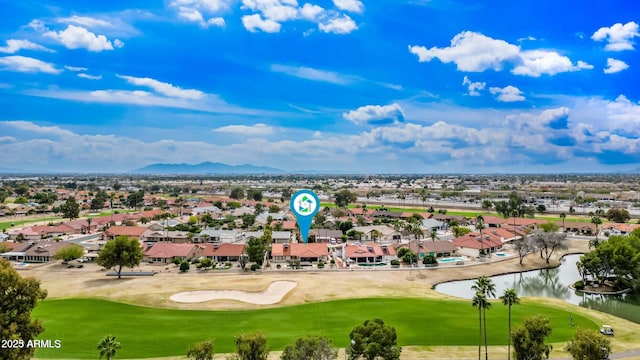 bird's eye view with a residential view, a water view, and view of golf course