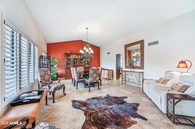 living area featuring visible vents, a chandelier, and vaulted ceiling