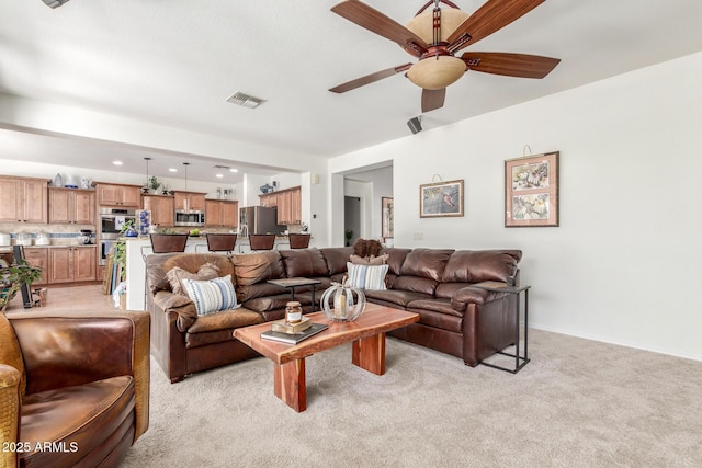 14363 W Acapulco Ln, Surprise, AZ 85379 - living room with visible vents, light carpet, recessed lighting, and ceiling fan
