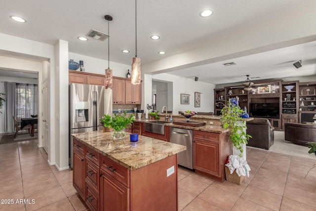 14363 W Acapulco Ln, Surprise, AZ 85379 - kitchen with a sink, appliances with stainless steel finishes, a peninsula, open floor plan, and visible vents