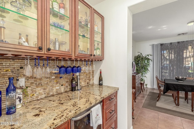 14363 W Acapulco Ln, Surprise, AZ 85379 - bar with wine cooler, pendant lighting, a bar, tasteful backsplash, and light tile patterned floors