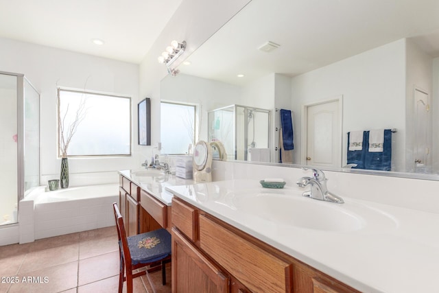 14363 W Acapulco Ln, Surprise, AZ 85379 - bathroom featuring a stall shower, vanity, a garden tub, tile patterned flooring, and visible vents