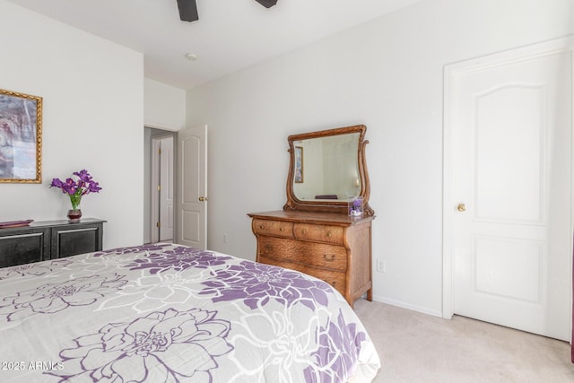 14363 W Acapulco Ln, Surprise, AZ 85379 - bedroom featuring light carpet, baseboards, and a ceiling fan