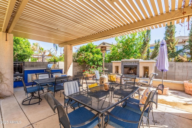 14363 W Acapulco Ln, Surprise, AZ 85379 - view of patio with a fenced backyard, outdoor dining area, an outdoor fireplace, and a pergola
