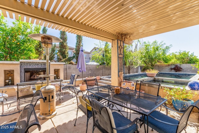 14363 W Acapulco Ln, Surprise, AZ 85379 - view of patio featuring exterior fireplace, a fenced backyard, outdoor dining space, a fenced in pool, and a pergola