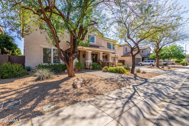 14363 W Acapulco Ln, Surprise, AZ 85379 - view of front of home with stucco siding, a garage, fence, and concrete driveway