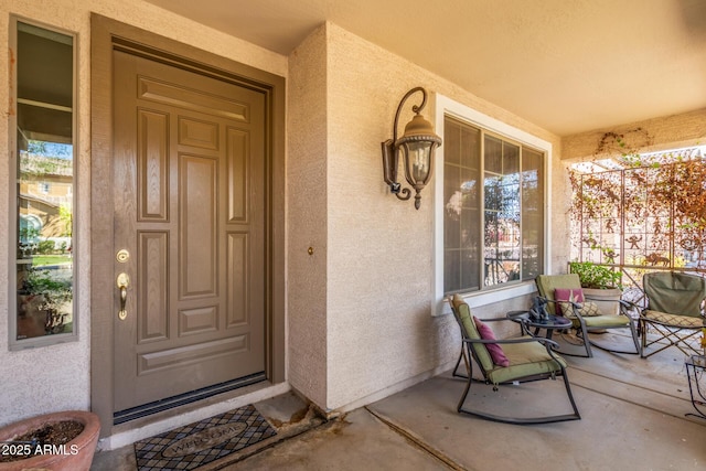 14363 W Acapulco Ln, Surprise, AZ 85379 - property entrance featuring a porch and stucco siding
