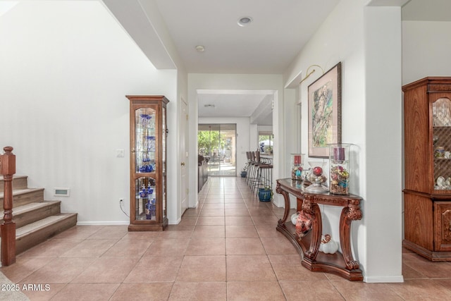 14363 W Acapulco Ln, Surprise, AZ 85379 - corridor featuring light tile patterned flooring, baseboards, and stairway
