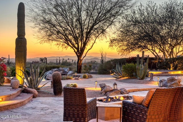 view of patio terrace at dusk