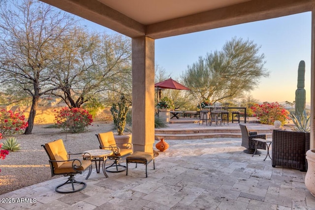 patio terrace at dusk with outdoor dining space