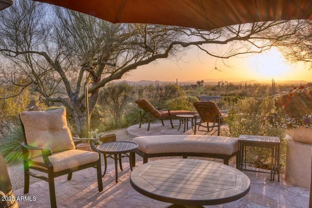 view of patio terrace at dusk