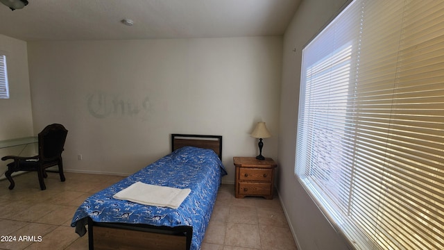 bedroom featuring light tile patterned floors