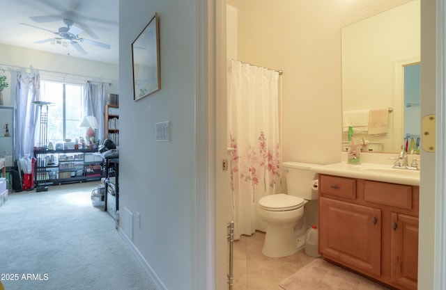 bathroom featuring a ceiling fan, tile patterned flooring, vanity, and toilet