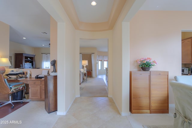 hallway with baseboards, light tile patterned floors, visible vents, and recessed lighting