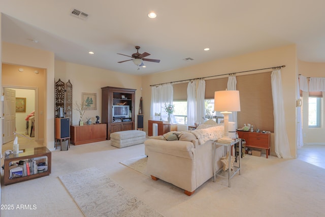 living area with light colored carpet, recessed lighting, visible vents, and ceiling fan