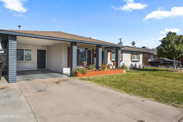 ranch-style home featuring a front yard and a carport