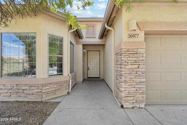 entrance to property featuring a garage