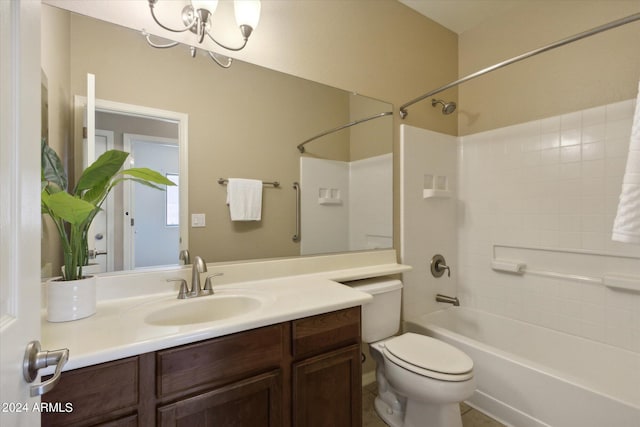 full bathroom with vanity, toilet, a chandelier, and tub / shower combination