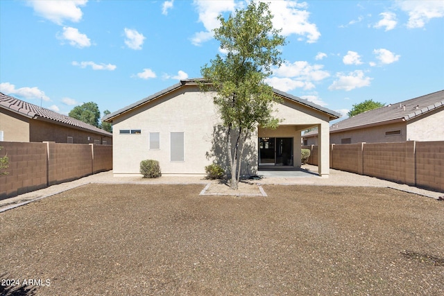 rear view of property with a patio