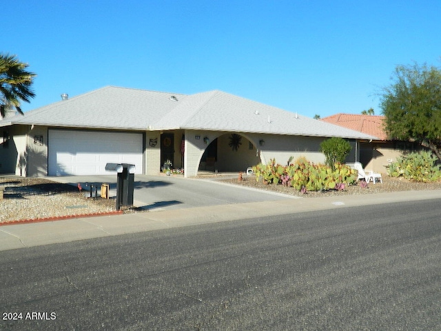 ranch-style home with a garage