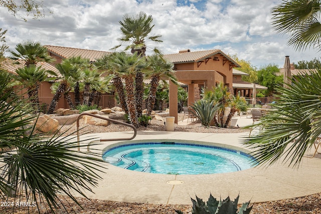 view of swimming pool with a patio area