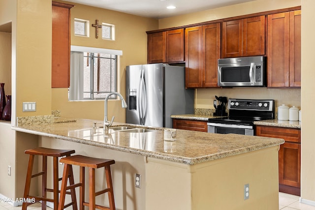 kitchen with plenty of natural light, kitchen peninsula, stainless steel appliances, and sink