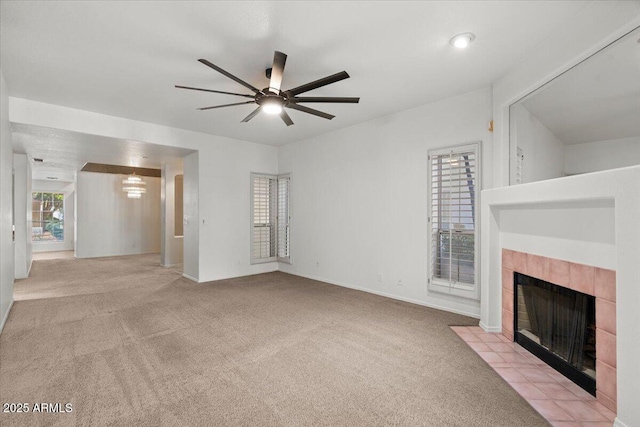 5200 S Lakeshore Dr Unit 120, Tempe, AZ 85283 - unfurnished living room featuring a tile fireplace, ceiling fan, carpet flooring, and baseboards