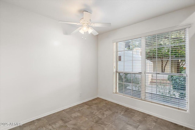 5200 S Lakeshore Dr Unit 120, Tempe, AZ 85283 - unfurnished room with plenty of natural light, baseboards, and ceiling fan