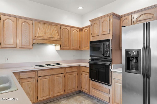 5200 S Lakeshore Dr Unit 120, Tempe, AZ 85283 - kitchen with black appliances, light countertops, premium range hood, and light brown cabinetry