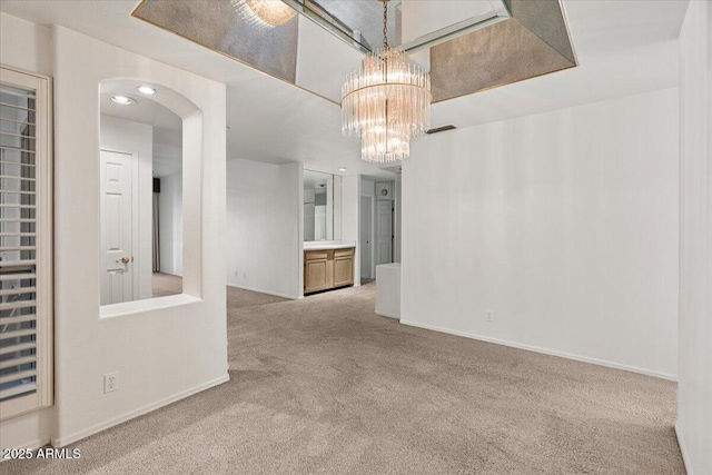 5200 S Lakeshore Dr Unit 120, Tempe, AZ 85283 - carpeted spare room featuring baseboards, arched walkways, a chandelier, and recessed lighting
