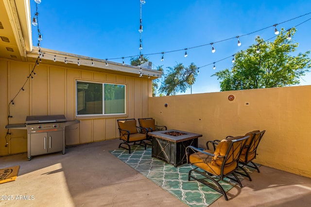 view of patio featuring a fire pit and area for grilling