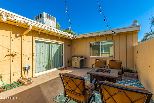 view of patio with a fire pit and area for grilling