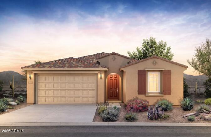 mediterranean / spanish house with a garage, concrete driveway, and stucco siding