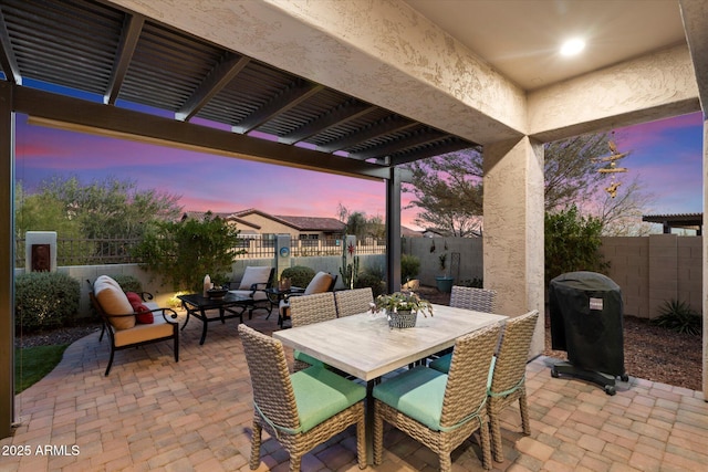 view of patio terrace at dusk