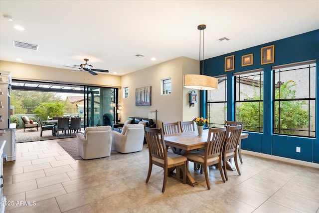 dining room featuring ceiling fan