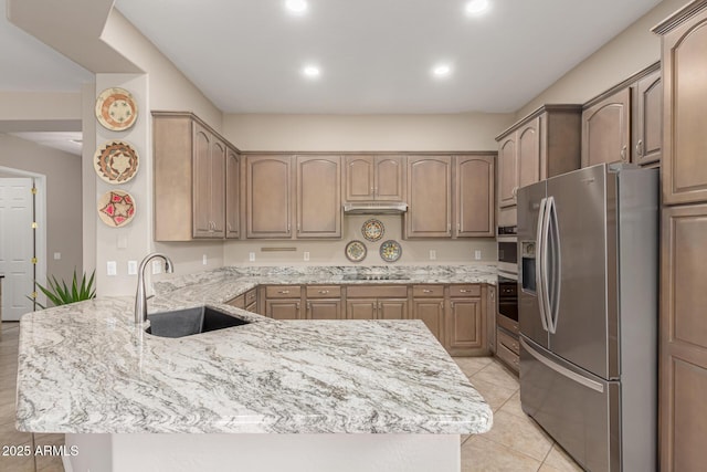 18247 N 168th Cir, Surprise, AZ 85374 - kitchen featuring stainless steel appliances, a sink, a peninsula, light stone counters, and light tile patterned flooring