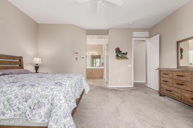 18247 N 168th Cir, Surprise, AZ 85374 - bedroom featuring light carpet, baseboards, ceiling fan, and ensuite bathroom