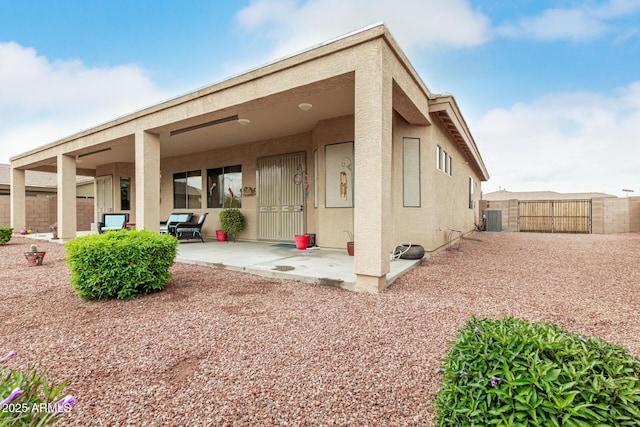 18247 N 168th Cir, Surprise, AZ 85374 - rear view of property featuring stucco siding, a patio area, a gate, cooling unit, and fence