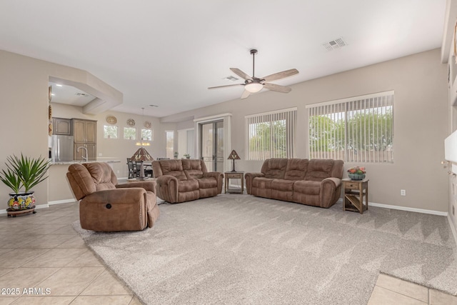 18247 N 168th Cir, Surprise, AZ 85374 - living room featuring ceiling fan, light tile patterned floors, and baseboards