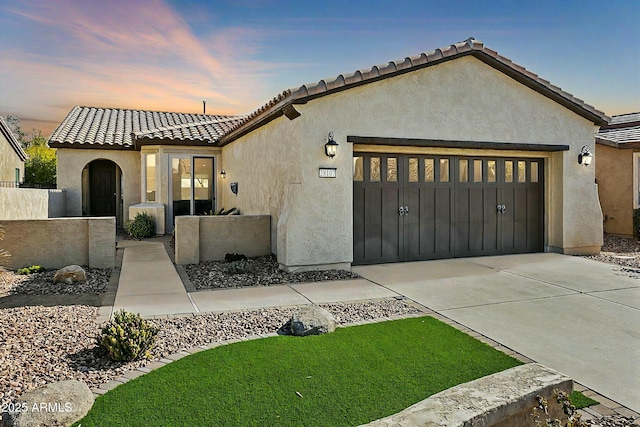 view of front of home with a garage