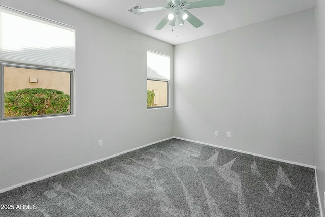 empty room featuring carpet flooring and ceiling fan