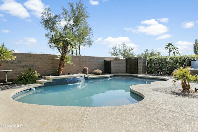 view of pool with pool water feature and a patio