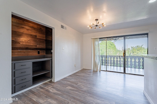 interior space featuring a notable chandelier and light hardwood / wood-style floors