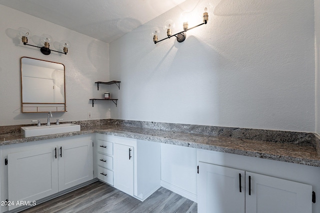 bathroom with vanity and hardwood / wood-style floors