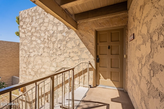 doorway to property featuring a balcony